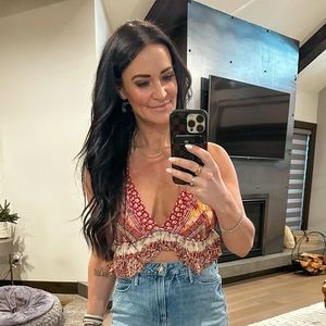 Free people tank top. Racerback style back. Adjustable straps. Size small.